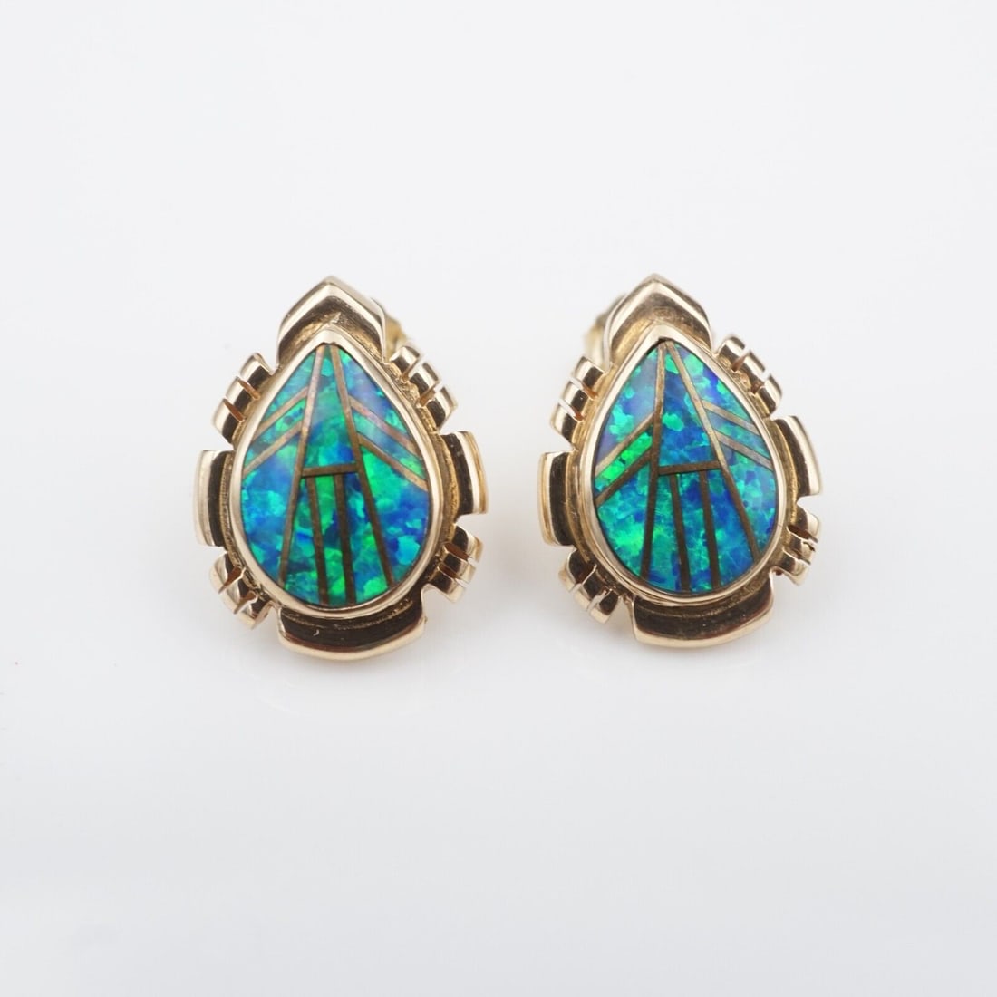 Vintage 14k Opal Inlay Earrings Teardrop Yellow Gold Blue Green Natural EG2587: These lovely pair artisan crafted earrings feature a geometric inlay of blue-green opal, bezel-set in a solid 14k yellow gold teardrop frame. The Southwestern style border and inlay work combine with 