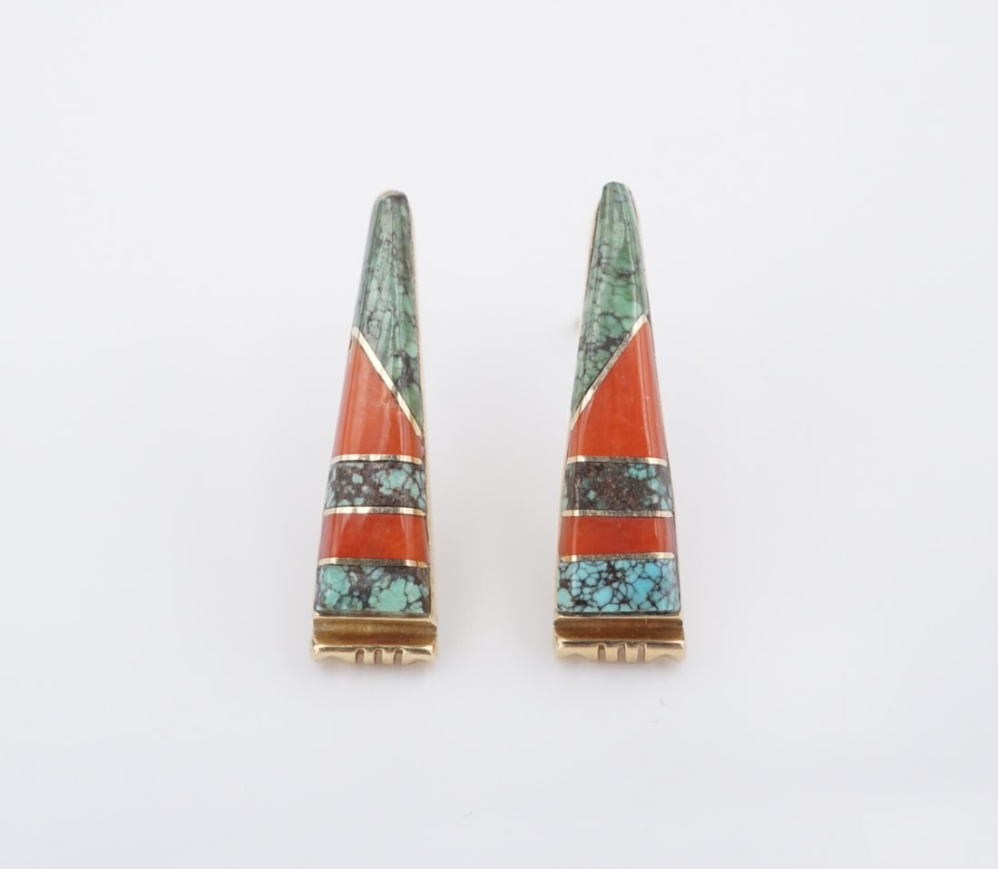 14k Navajo Inlay Earrings Turquoise Coral Yellow Gold Danny Clark Signed EG2512: These lovely pair of earrings from Navajo artisan Danny Clark feature a geometric inlay of turquoise and red coral, bezel-set in a triangular frame. Crafted in solid 14k yellow gold, these earrings ar