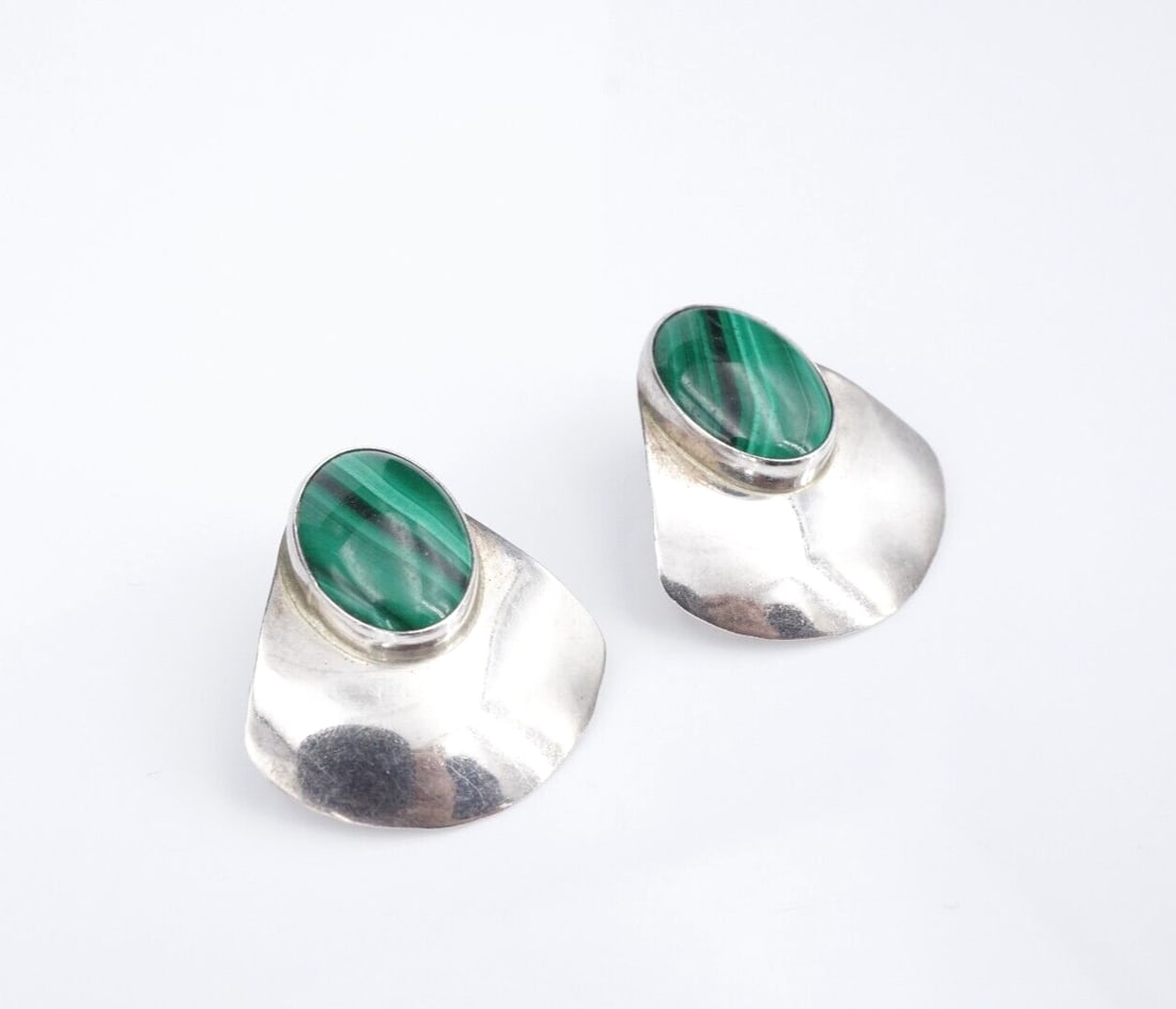 Native Sterling Silver Button Earrings Malachite Mark Jimenez 1.2" ES2561: These Native American earrings feature a bezel-set malachite cabochon set at the top of a peacock tail shaped fan crafted of solid sterling silver. A fun accessory for day or night! Metal Type: Sterli