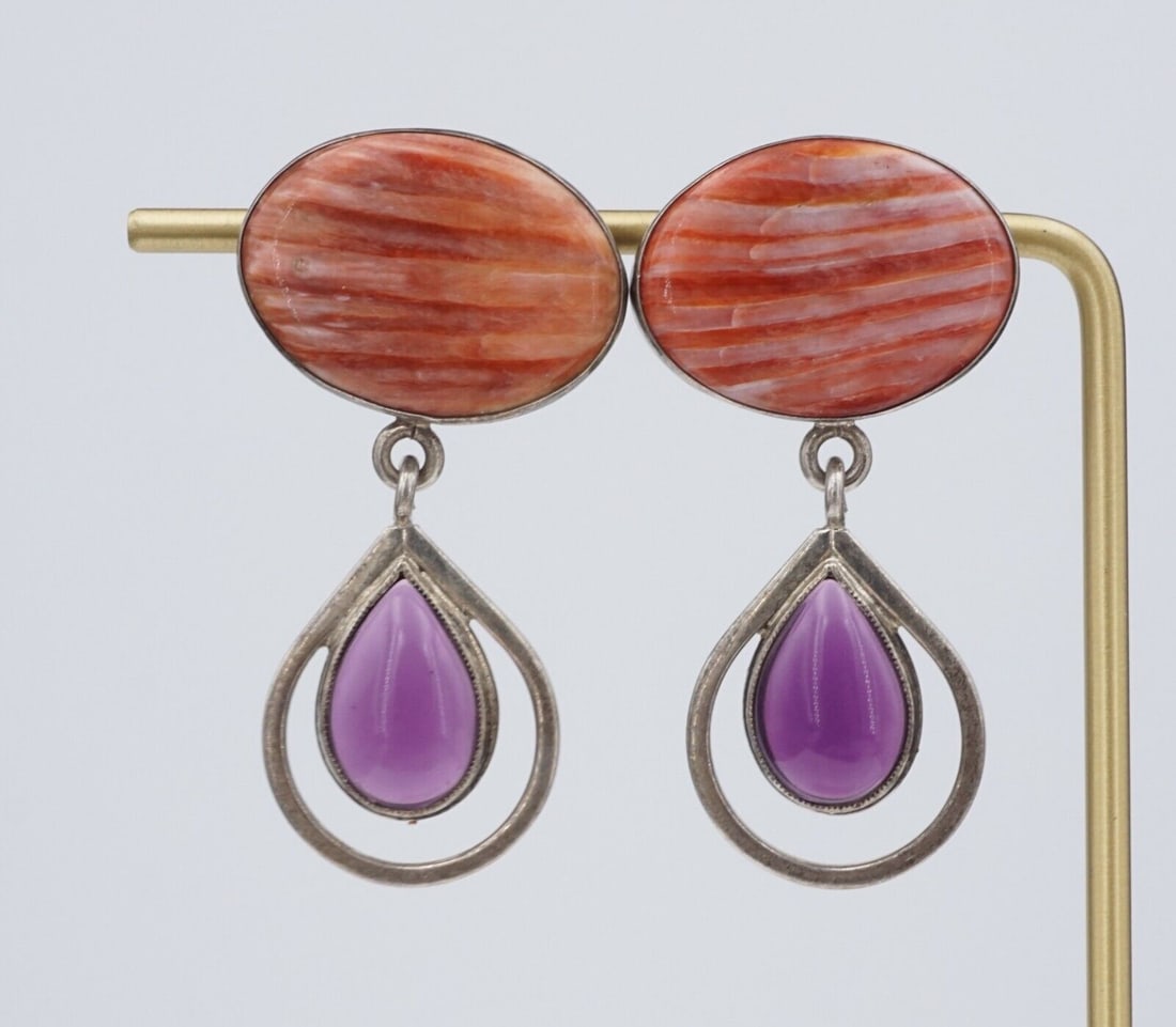 Les Baker Navajo Spiny Oyster Amethyst Dangle Earrings 1.9" Unique ES2645: These beautiful Navajo artisan dangle earrings feature a gorgeous amethyst cabochons suspended from vibrant orange spiny oyster shell slabs. The earrings are crafted from solid sterling silver hooks, 