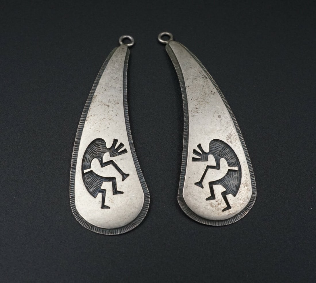 Hopi Earrings Sterling Silver Overlay Kokopelli Raymie Namingha 2.5" ES2191: These awesome teardrop dangle earring charms are crafted from solid sterling silver, and feature overlay work done by a Hopi artisan, depicting the traditional kokopelli humpbacked flute player. A mea