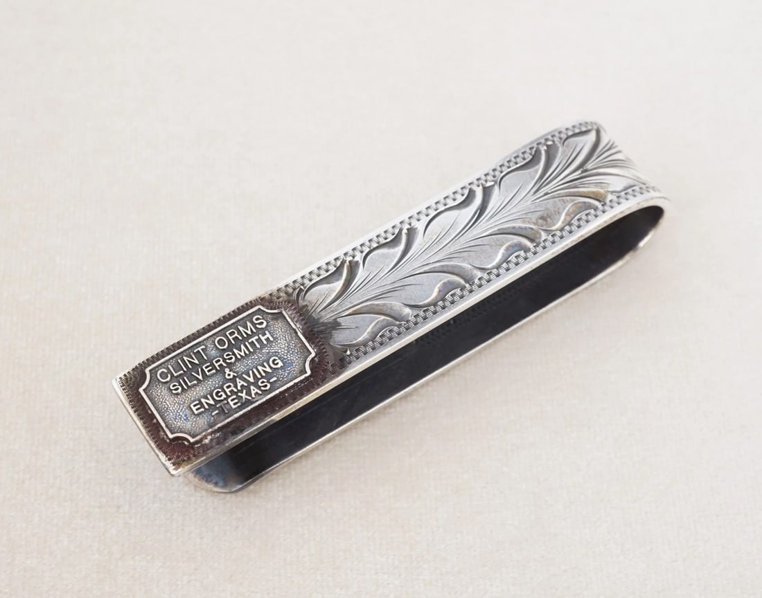Clint Orms Hand Engraved Sterling Silver Money Clip 2.4" M2124: This classic money clip by Silversmith Clint Orms for Rewards features a slim construction lined with an etched foliate vine design, crafted in solid sterling silver. The ultimate gift for the man wit