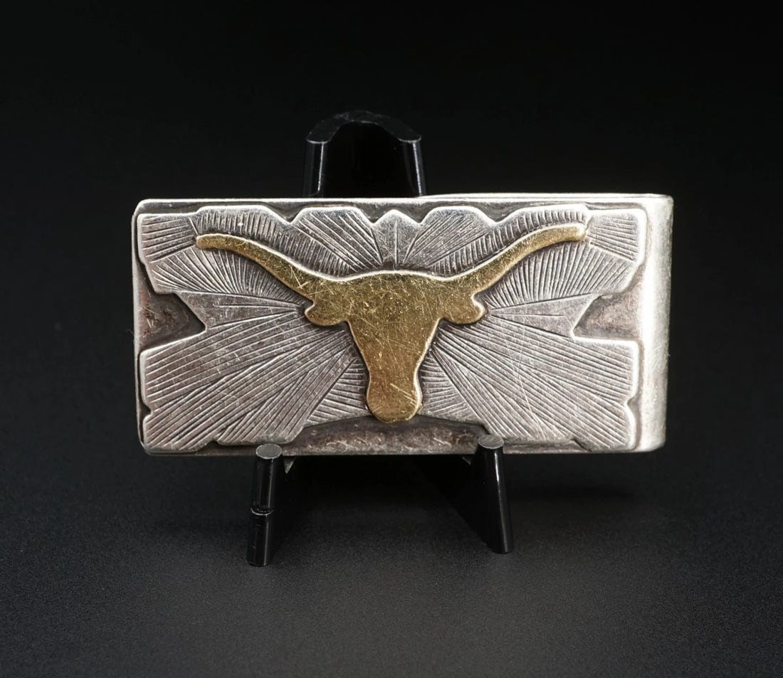 Edward Baird Sterling Silver 14k Gold UT Longhorn Money Clip 2.25" Rewards M2077: This classic money clip by Silversmith Edward Baird for Rewards features a longhorn head crafted of 14k gold overlaid on a geometric striped background atop a polished look crafted in solid sterling s