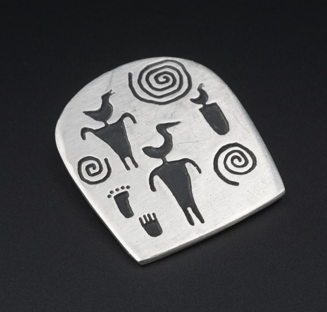 Alice Seely Urban Fetishes Tribal Pin New Mexico Southwest Pewter 1.75" OS619: This beautiful pewter brooch by New Mexico artist, Alice Seely, features urban petroglyphs blackened against the brushed metal surface. A unique and eye catching piece of jewelry, handmade in the USA!
