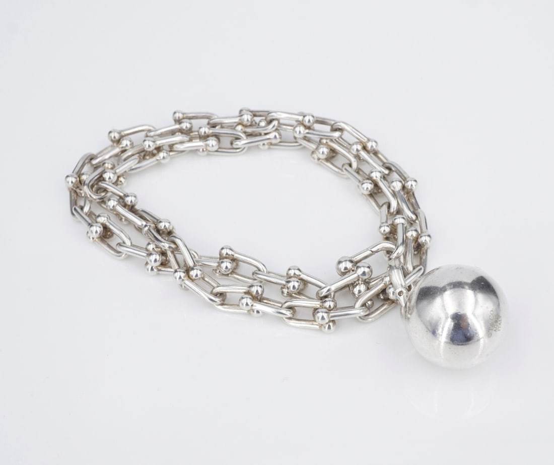Tiffany & Co Hardwear Ball Lock Chain Link Wrap Bracelet Sterling Silver BS3085: The Tiffany & Co Hardwear "Small Wrap Bracelet" features lock links with a ball charm. This bracelet is described as, "Tiffany HardWear is an expression of love's transformative strength. Inspired by 