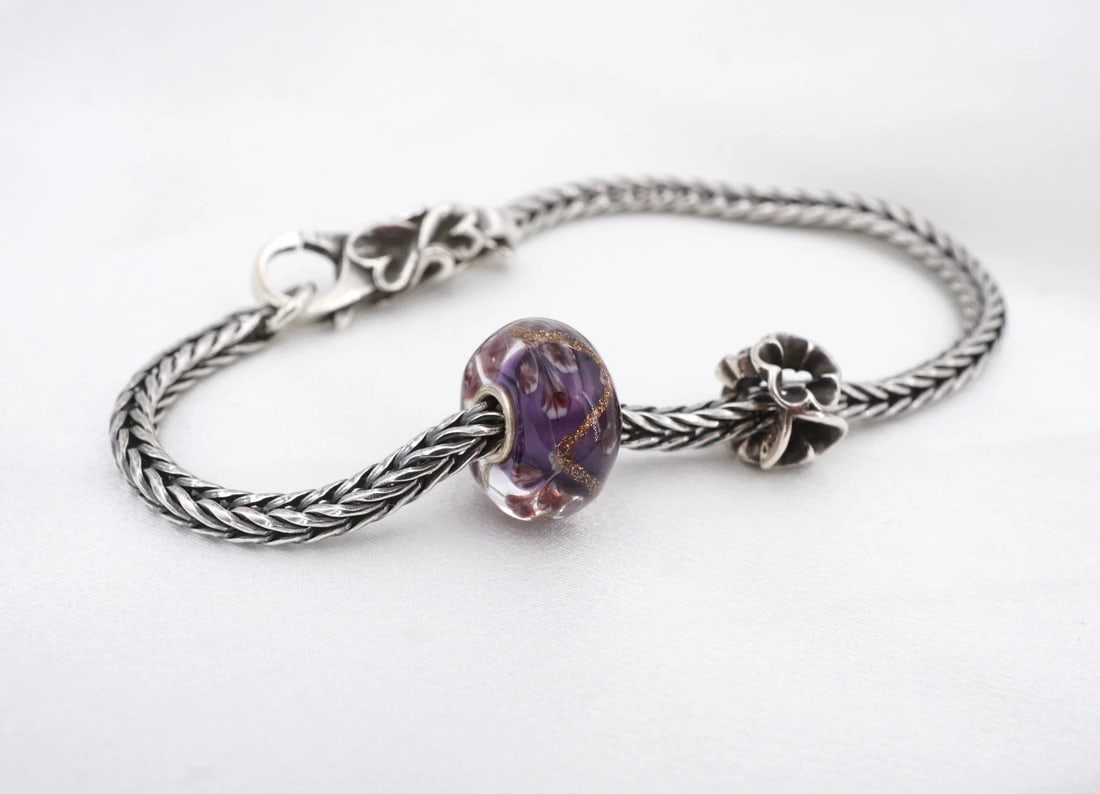 Trollbeads Charm Sterling Silver Bracelet Vine of Dreams LAA 2018 Ltd. BS3372: This Trollbeads "Vine of Dreams" bracelet features 2 charms on an authentic foxtail chain with lobster clasp. A 2018 limited edition design. We are not Trollbead experts but are happy to answer questi