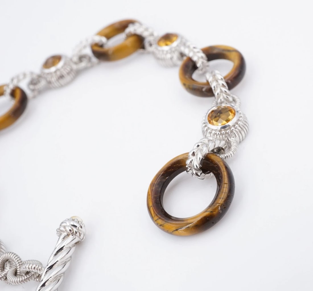 Judith Ripka Citrine Tiger's Eye Link Bracelet Sterling Silver 8" Toggle BS3296: This, Judith Ripka bracelet features carved tiger's eye links set between ornate citrine stations, all crafted in solid sterling silver. Metal Type: Sterling Silver Notable Marks: Judith Ripka 925 Tha