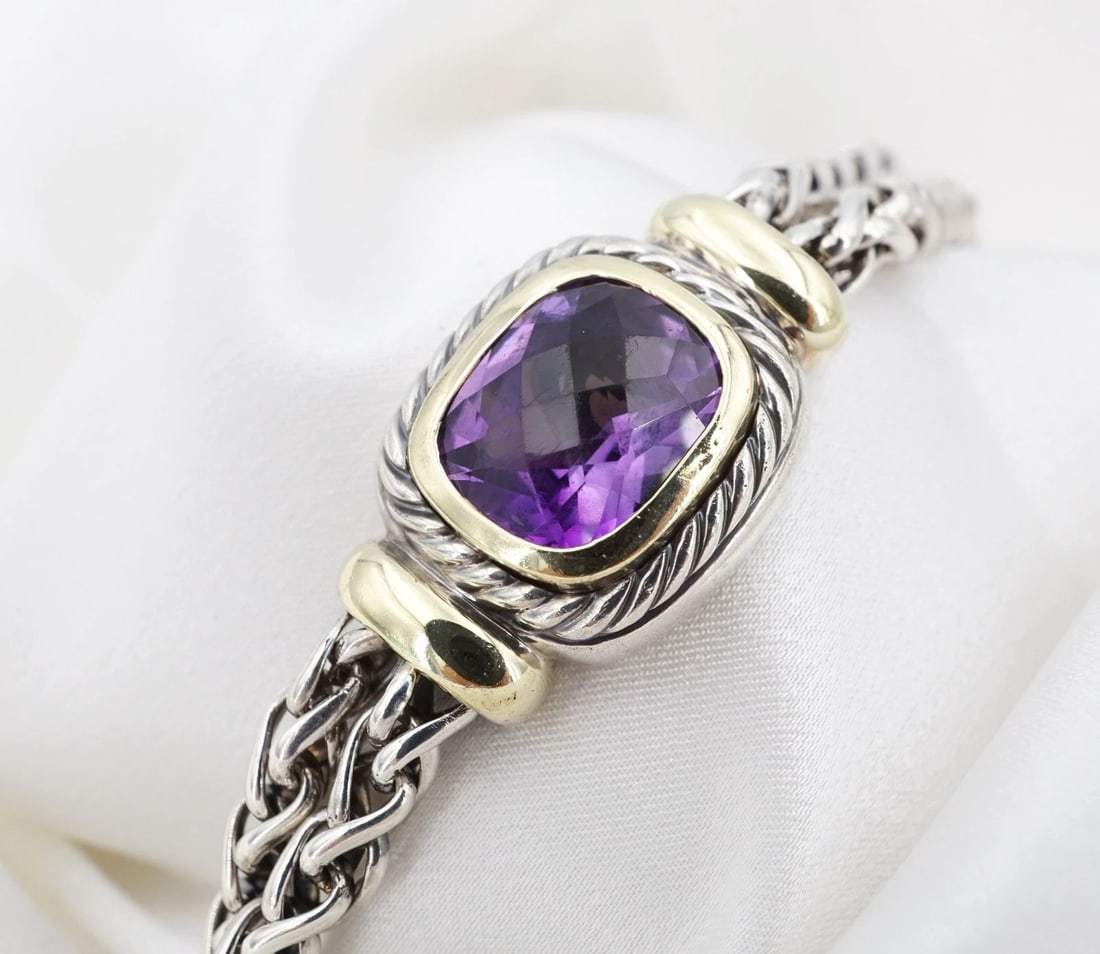 David Yurman Albion Double Wheat Bracelet Amethyst 14k Sterling Silver 7" BS3191: This bracelet from David Yurman features a vivid, checkerboard cushion-cut amethyst gemstone set in a 14k yellow gold bezel atop a sterling silver frame with an intricate rope texture. Complete with t