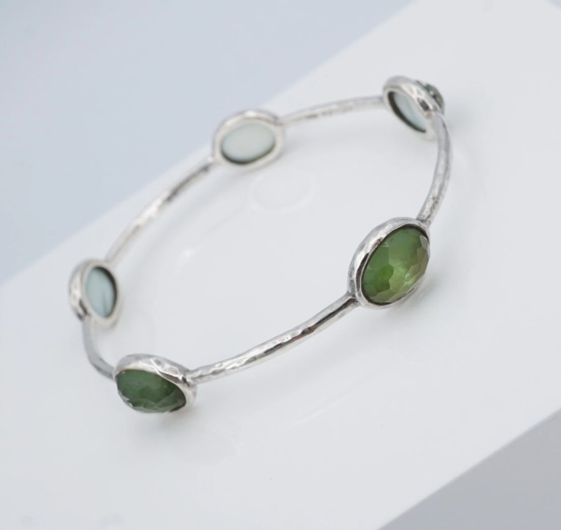 Ippolita Rock Candy Mother of Pearl Quartz 5 Station Bracelet Sterling BS3324: This bracelet by designer Ippolita features five oval doublet stations of mother of pearl and quartz set in hammered sterling silver bezels. Each station is evenly spaced along a slim sterling silver 
