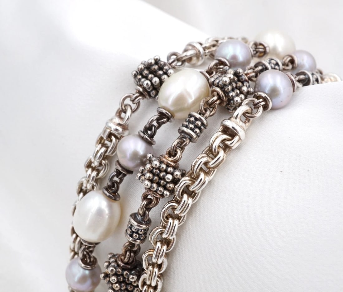 Michael Dawkins Sterling Silver Freshwater Pearl 4-Row Bead Bracelet 7" BS3366: This chunky Michael Dawkins bracelet features a 4-row construction with grey and white pearl stations and bead accents. Featuring luminous cultured pearls accented by his signature sculptural silver b