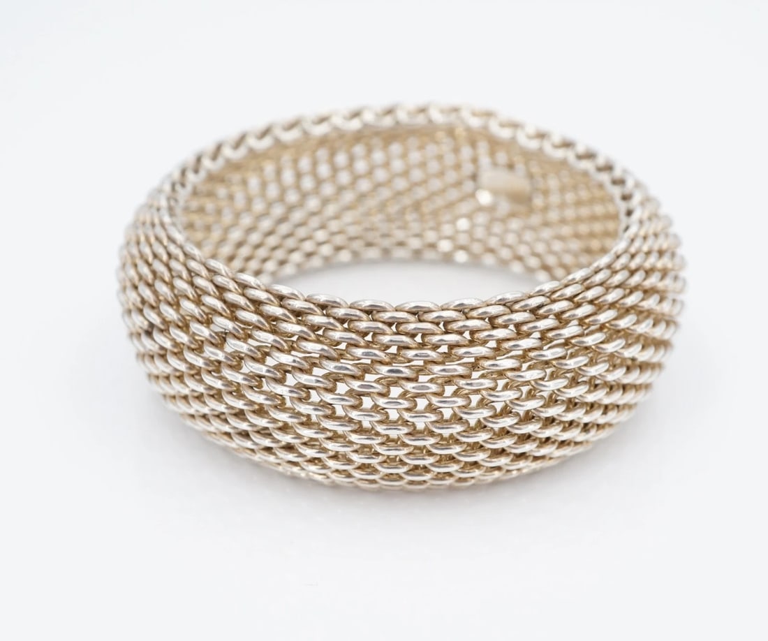 Tiffany & Co. Somerset Bangle Bracelet Sterling Silver 7" 26.4mm Large BS3261: This large retired Tiffany & Co. "Somerset" bracelet features a chunky, flexible mesh bracelet design crafted of solid sterling silver. Metal Type: Sterling Silver Notable Marks: Tiffany & Co 925 Meas