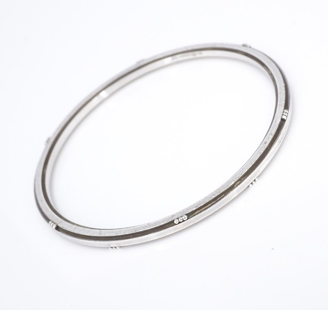 Vintage Georg Jensen Sterling Silver Bangle Bracelet 7.5" 51B Denmark BS3036: This bracelet from designer Georg Jensen features a solid sterling silver bangle design with a beveled edge and quaint bead accents. Metal Type: Sterling Silver Notable Marks: 51B Georg Jensen S 925 D