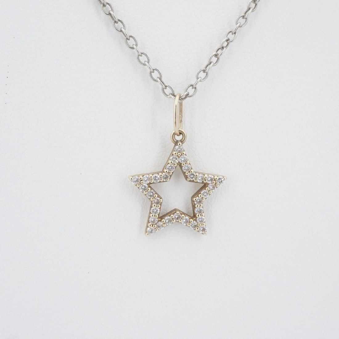 Sonja Picard 14k Gold Sterling Diamond Destiny Star Necklace 23" CO1273: This designer Sonja Picard necklace, from her Boho Shakti collection, features a sparkling diamond open star crafted in 14k yellow gold. The pendant slides easily on a supple sterling silver cable lin