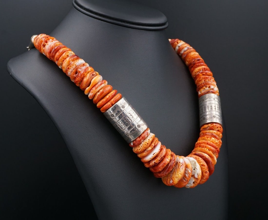 Wayne Aguilar Santa Domingo Kewa Spiny Oyster Sterling Silver Necklace NS2195: From artist Wayne Aguilar, this handsome Santo Domingo Pueblo necklace features spiny oyster shell wide beads decorated set with sterling silver beads. Hand stamped sterling silver tips and an adjusta