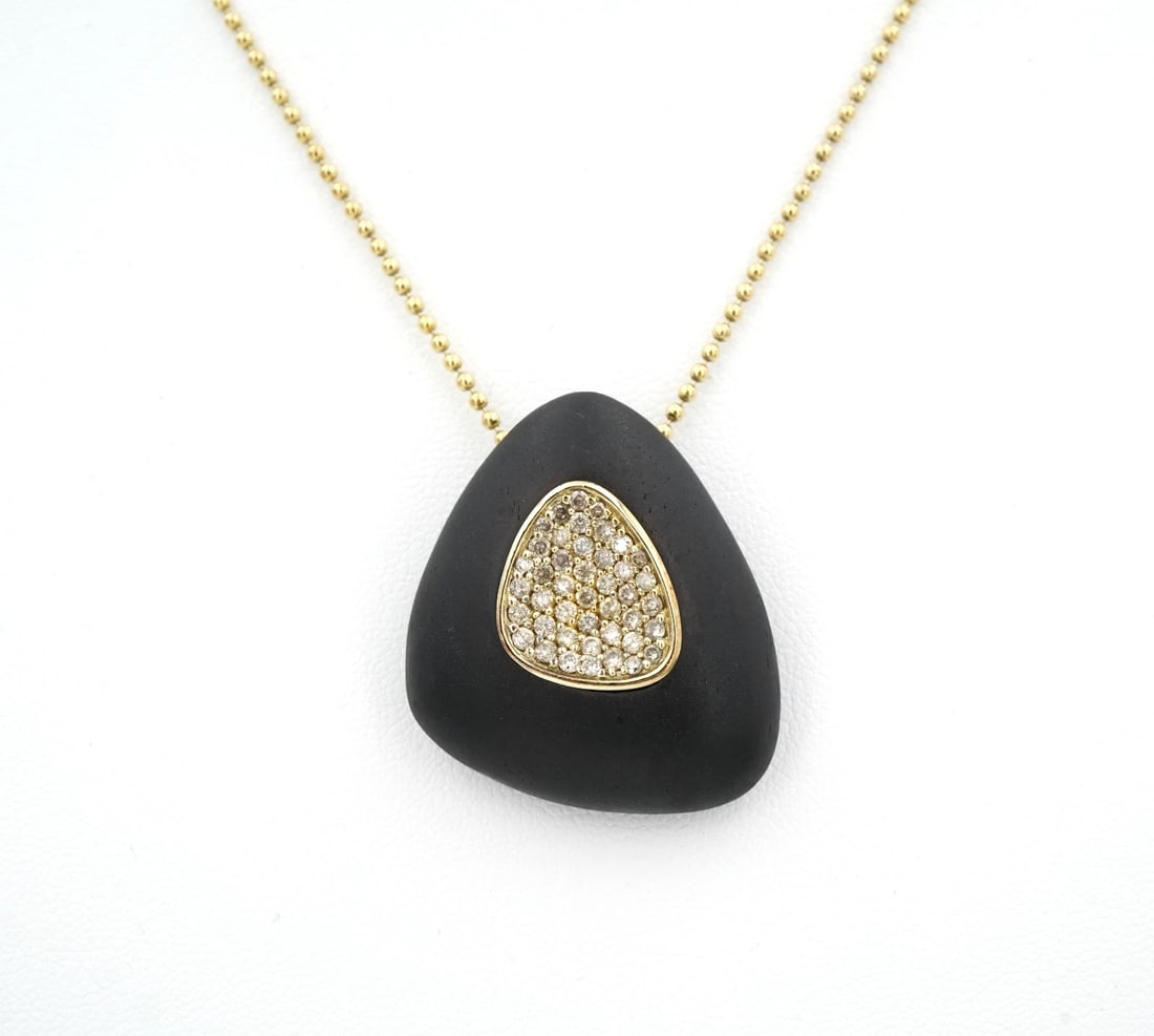 Roberto Coin Capri Plus Diamond Necklace Ebony Wood Sterling Silver 18" NS2468: A designer piece by Roberto Coin, this bold necklace features a large ebony wood pendant with a field of pave diamonds inset into the face. Siding smoothly on a vermeil bead chain. Metal Type: Sterlin