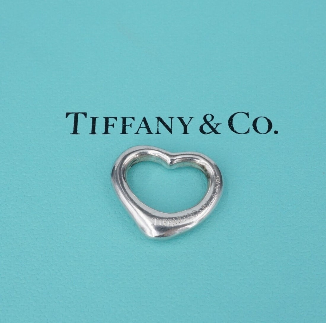 Tiffany & Co Open Heart Pendant Elsa Peretti Sterling Silver 21mm PS2153: This classic Tiffany & Co. pendant by designer Elsa Peretti features a classic open heart design crafted of solid sterling silver. Described by Tiffany as "The simple, evocative shape of Elsa Peretti 