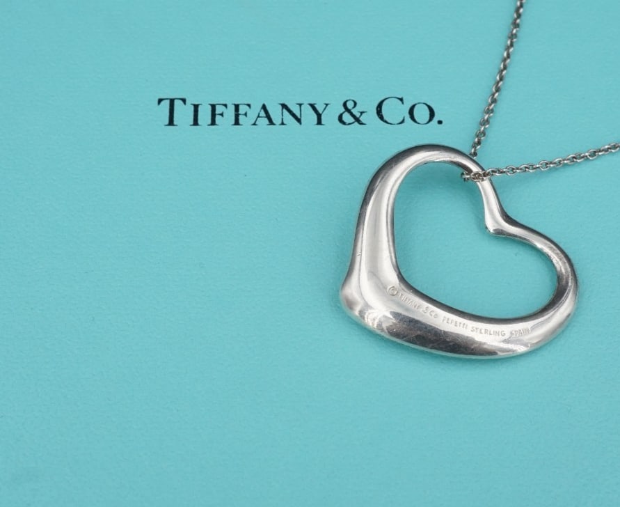 Tiffany Co Large Open Heart Pendant Necklace Peretti Sterling Silver 30" NS2316: This classic Tiffany & Co. necklace by designer Elsa Peretti features her iconic open heart design crafted of solid sterling silver hanging from a delicate 30" cable chain. Described by Tiffany as "Th