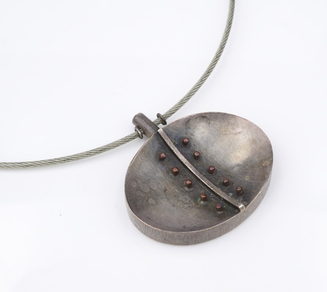 Baharel & Gnida Spoon Pendant Necklace Sterling Silver Brass 18" Vintage NS2307: This necklace from the Baharel + Gnida "Spoons" collection features a curved, ovular pendant embellished with brass toned bead accents. The pendant is suspended from a slim stainless steel cable with 