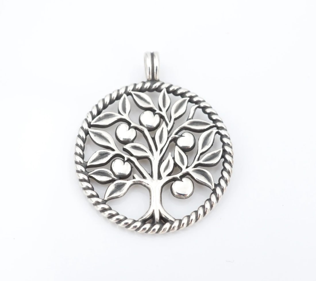 James Avery Tree of Life Pendant Sterling Silver 1.4" Large Retired PS2312: This retired "Tree of Life" pendant from James Avery features an intricate 3D fruit tree design set in an open circle frame with a rope texture. Crafted in solid sterling silver. Metal Type: Sterling 
