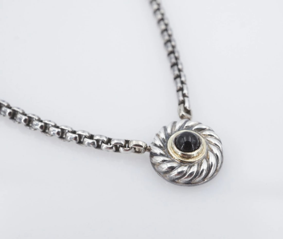 David Yurman Onyx Cookie Pendant Necklace 16" Sterling Silver 14k Gold NS2362: This retired necklace from David Yurman's Cookie Collection features a petite onyx cabochon framed in 14k gold atop a round cable pendant fixed on a supple rolo chain crafted in sterling silver. Metal