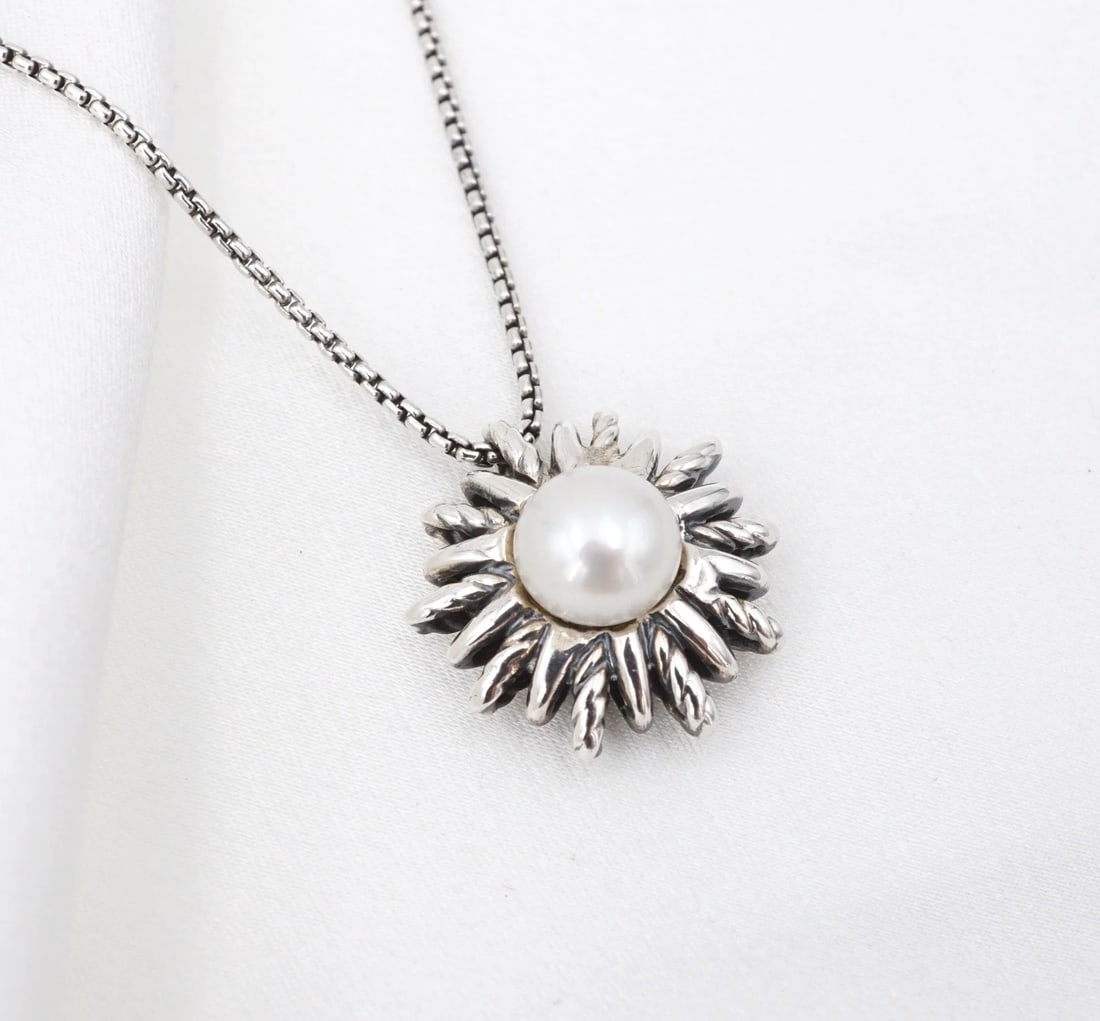 David Yurman Pearl Starburst Pendant Necklace 16"-18" Sterling Silver NS2495: This retired necklace from David Yurman's Starburst Collection features a lustrous pearl set within a starburst pendant, which slides smoothly on a supple rounded box chain crafted in sterling silver.