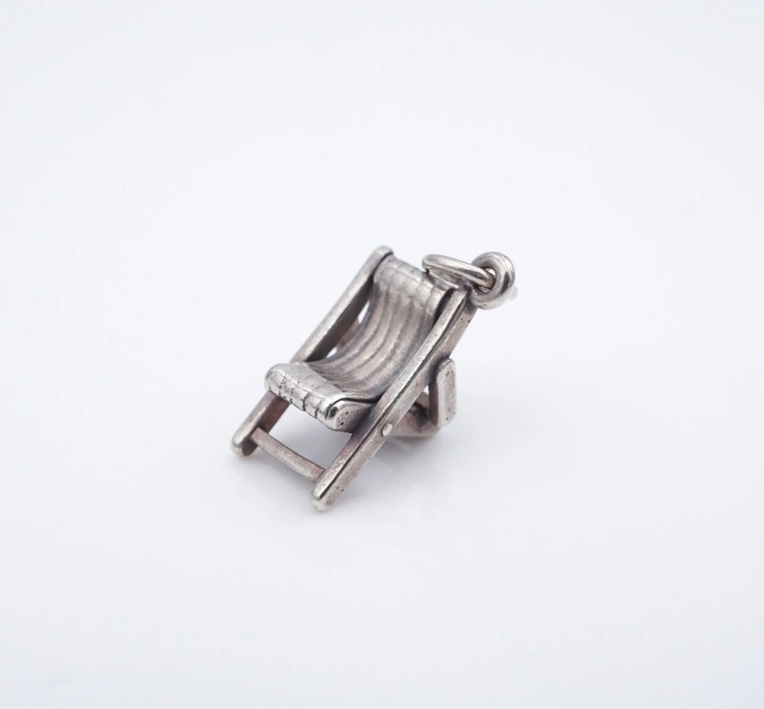 James Avery 3D Lawn Beach Chair Charm Pendant Sterling Silver" Retired CHS2332: This piece is a retired James Avery design, featuring an intricate, 3D lawn chair design crafted in solid sterling silver. Metal Type: Sterling Silver Notable Marks: James Avery Hallmark 925 Measureme
