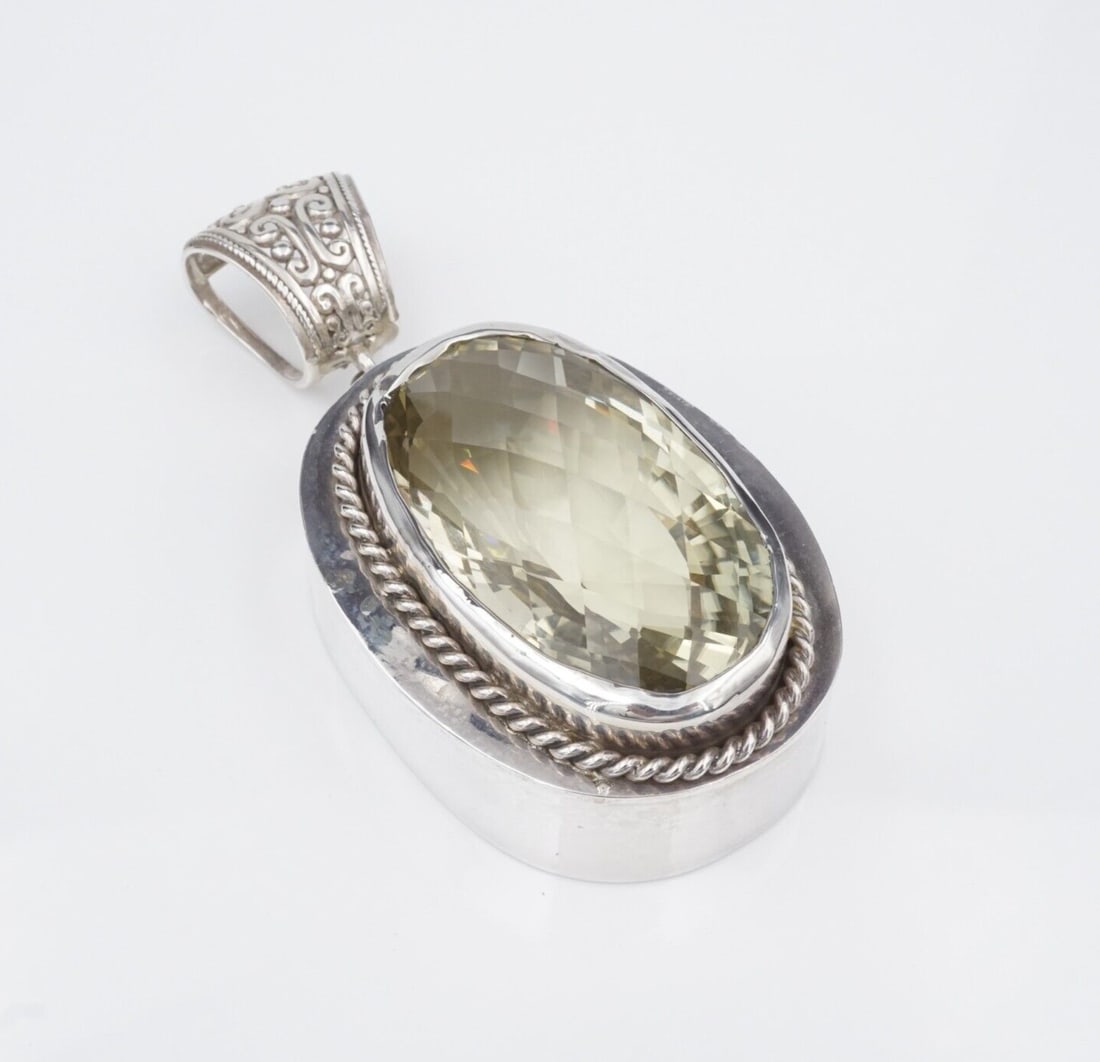 Sterling Silver Pendant Prasiolite Massive 3.5" 80g JR Designs 200ct PS2223: This artisan crafted pendant features a 223 carat oval prasiolite (green amethyst) bezel-set within a rope bordered frame. The large, tapered bale gives this piece a bold look and provides great movem