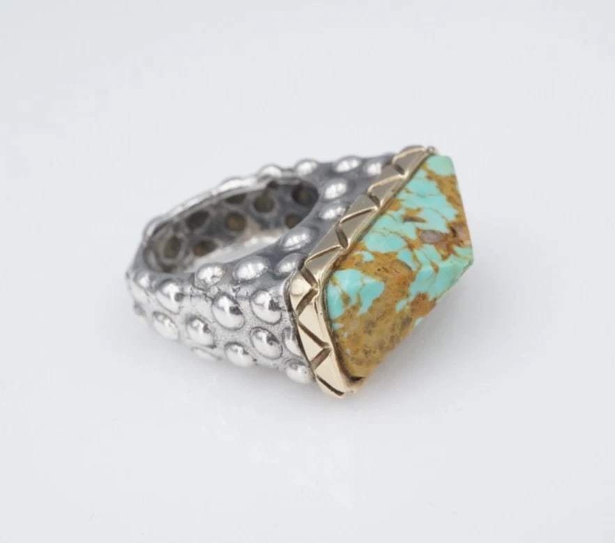 Dian Malouf Vintage Turquoise Ring Sterling Silver 14k Gold Size 7 RS3858: This Dian Malouf ring features her iconic styling with an angled green turquoise cabochon bezel set atop a large 14k accent. The wide band is embellished with raised textured designs, adding to the ap