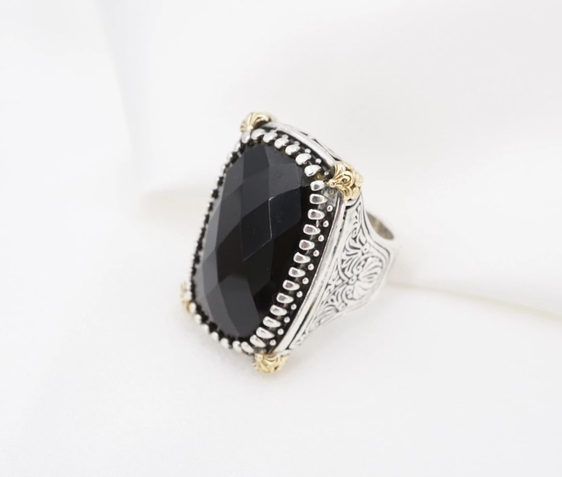 Konstantino Black Onyx Sterling Silver 18k Yellow Gold Nykta Ring Sz 6.5 RS4083: This unique Konstantino "Nykta" ring features a large shield construction with ornate swirl and rope details. It is embellished with a checkerboard faceted black onyx accent at center with 18k yellow 