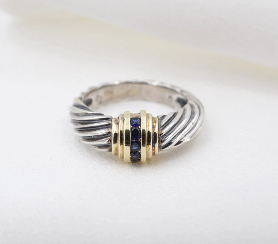 David Yurman Cable Dome Ring Sapphire Sterling Silver 14k Gold Size 6.25 RS4064: This retired David Yurman Cable Dome ring features natural round sapphires flush mounted in a bar of 14k yellow gold atop a sterling silver band with a cable-style shank. Metal Type: Sterling Silver a