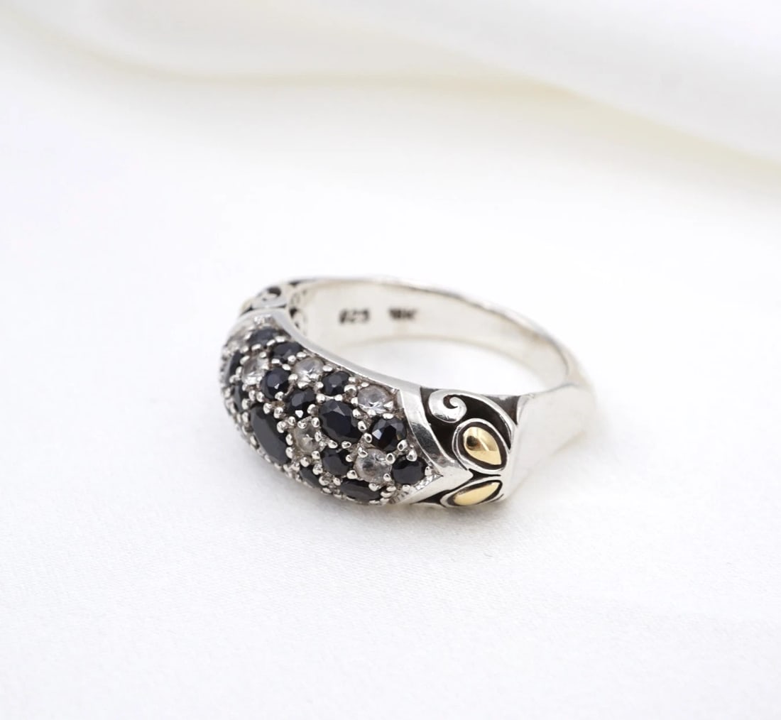 John Hardy Pave Sapphire Diamond Band Ring Sterling Silver 18k Gold 7.5 RS4065: This ring from designer John Hardy features a cluster of round & oval-cut black sapphires and natural round diamonds pave-set across the face of a wide sterling silver band embellished with 18k yellow