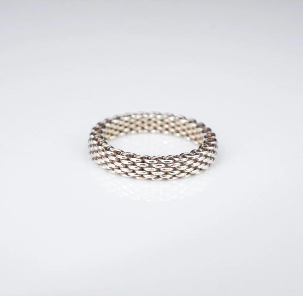 Tiffany & Co. Narrow Somerset Band Ring Sterling Silver 7 3.6mm Pouch RS3935: This retired Tiffany & Co. "Narrow Somerset" ring features an intricate mesh construction crafted in solid sterling silver. Metal Type: Sterling Silver Notable Marks: T & Co 925 Measurements: Size 7; 
