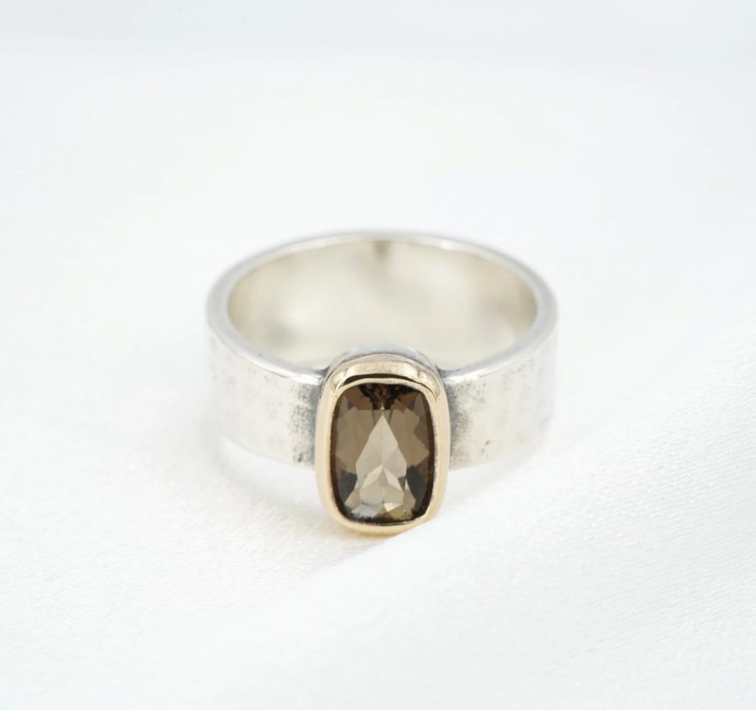 James Avery Graciela Smokey Quartz Ring Sterling 14k Gold Sz 7.75 Retired RS4069: This retired "Graciela" ring from James Avery features an elongated cushion-cut smokey quartz set in a rich 14k yellow gold bezel atop a wide sterling silver band with a hammered texture. Metal Type: 