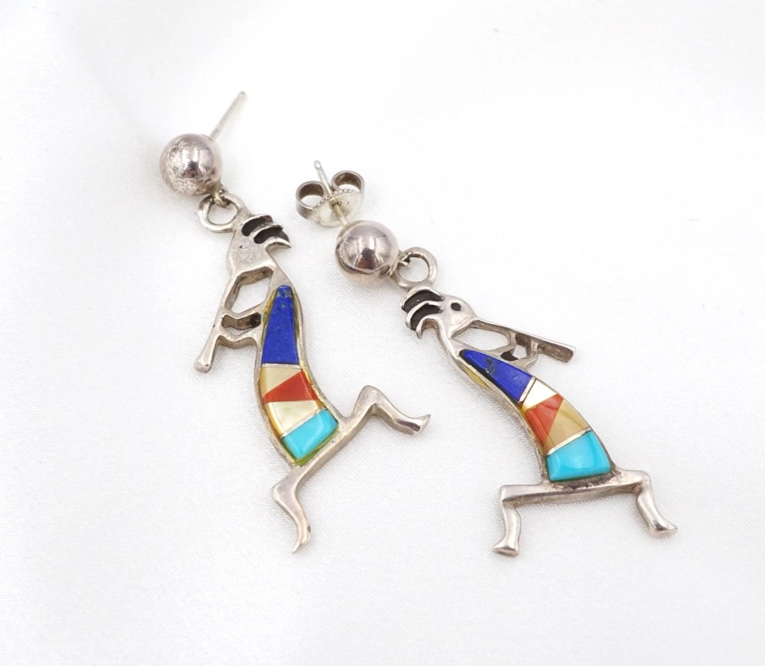 Rock Kritters Kokopelli Inlay Drop Earrings Gemstone Sterling Silver 1.6" ES2893: These earrings from the Rock Kritters jewelry line feature a classic Kokopelli silhouette crafted in solid sterling silver with a geometric inlay of natural turquoise, lapis, red coral and mother of p