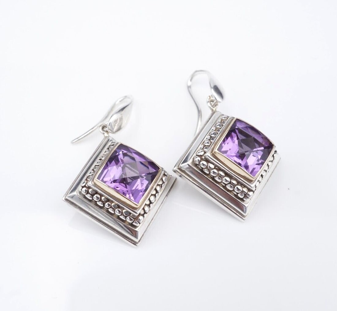 Michael Dawkins Amethyst Dangle Earrings 2-Tone Sterling Silver 1.5" ES2654: These dangle earrings from designer Michael Dawkins feature a faceted amethyst gemstone bezel set in a gold tone frame atop a tiered, square shaped construction with delicate bead accents. Set in soli
