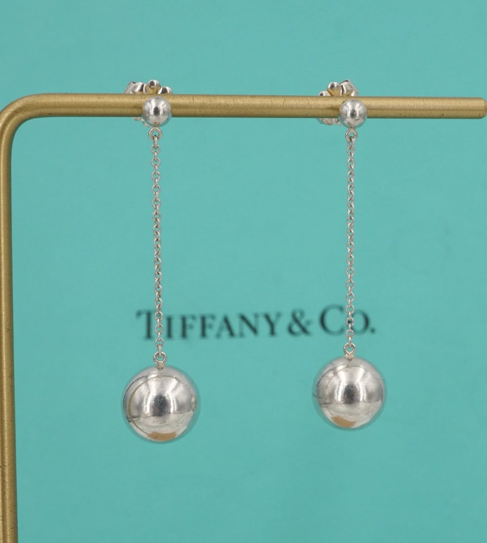 Tiffany & Co. Hardwear Ball Drop Earrings Sterling Silver 1.7" Retired ES2772: These retired Tiffany & Co. "HardWear" earrings feature a sterling silver bead stud embellished with a large ball design suspended from a supple cable chain. Metal Type: Sterling Silver Notable Marks: