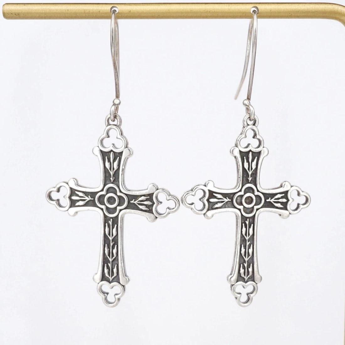 James Avery Openwork Edges Budded Cross Earrings Sterling Silver Retired ES2834: This pair of retired earrings from James Avery feature a unique detailed "Openwork Edges Budded Cross" design crafted of solid sterling silver. The earrings fasten securely with hooks for pierced ears