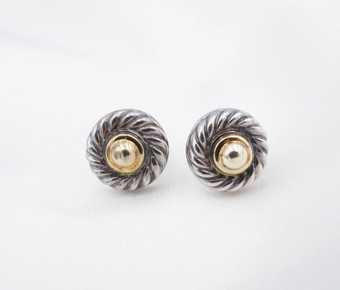 David Yurman Cookie Stud Earrings Sterling Silver 14k Gold 11.7mm Retired ES2882: This retired pair of studs from David Yurman's Cookie Collection feature a round sterling silver cable design embellished with a bead of yellow gold in the center. Metal Type: Sterling Silver and 14k 