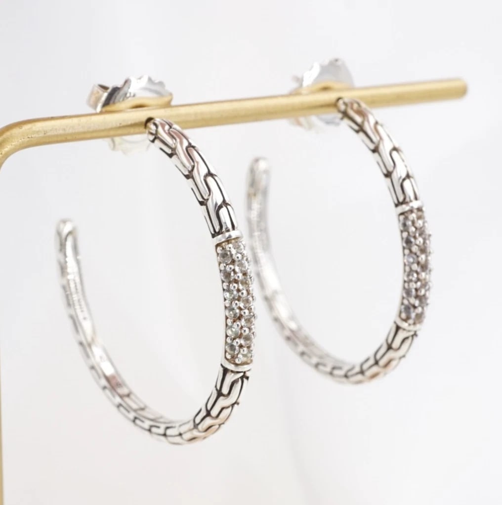 John Hardy Pave Sapphire Classic Chain Hoop Earrings Sterling Silver 1.5" ES2886: These iconic earrings from designer John Hardy feature a large, sterling silver hoop with the iconic classic chain texture. Each hoop is embellished with a line of pave white sapphires that cascade do