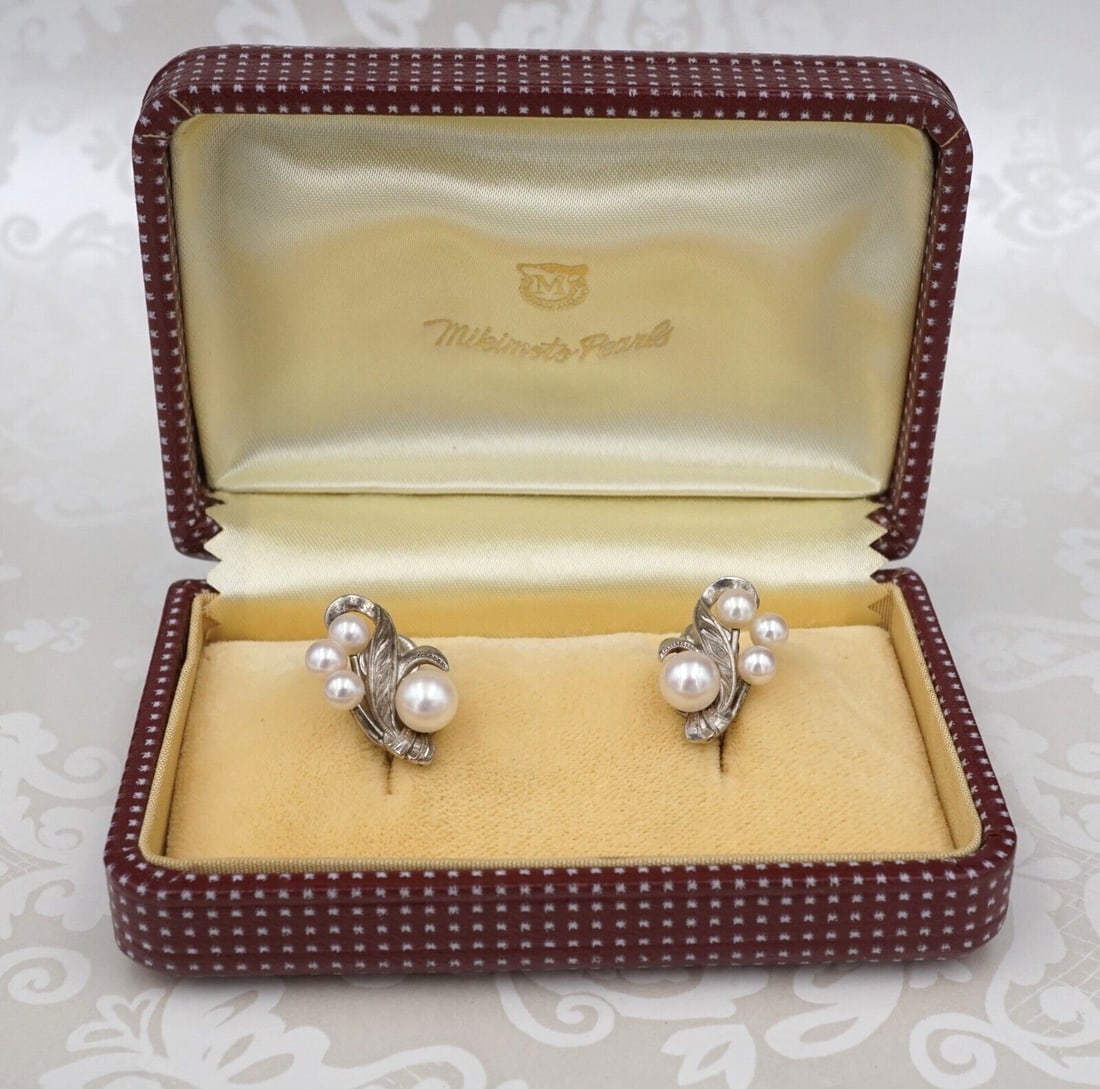 Vintage Mikimoto Pearl Earrings Sterling Silver Cluster Screw Backs Box ES2471: Pearls are the rage this year. These vintage statement earrings by Mikimoto each feature a cluster of pearls in a foliate wave design. The earrings securely fasten with screw backs for non-pierced (or