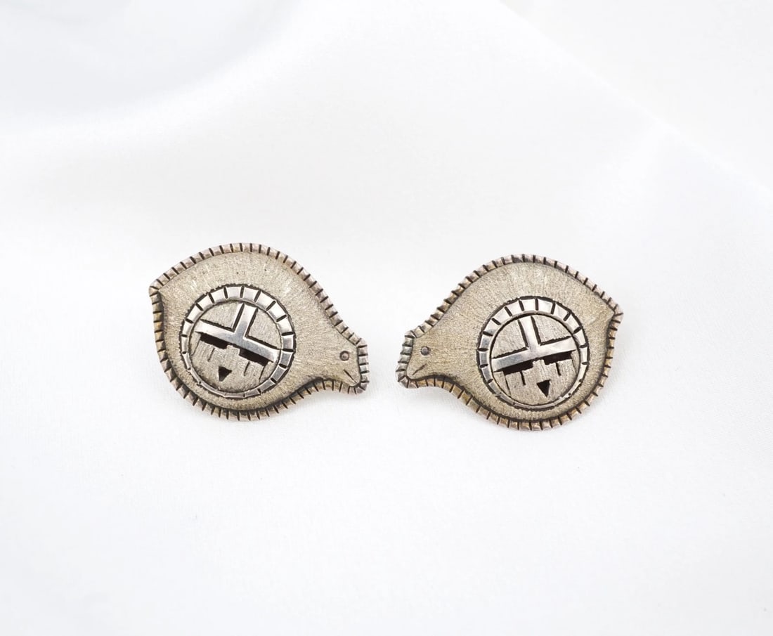 Navajo Spirit Bear Sunface Stud Earrings Sterling Silver 0.7" Joe Willeto ES2854: These earrings from Navajo artisan Joe Willeto each feature a rounded spirit bear silhouette embellished with an ornate Sunface overlay in the center. Each earring is adorned with a brushed texture an