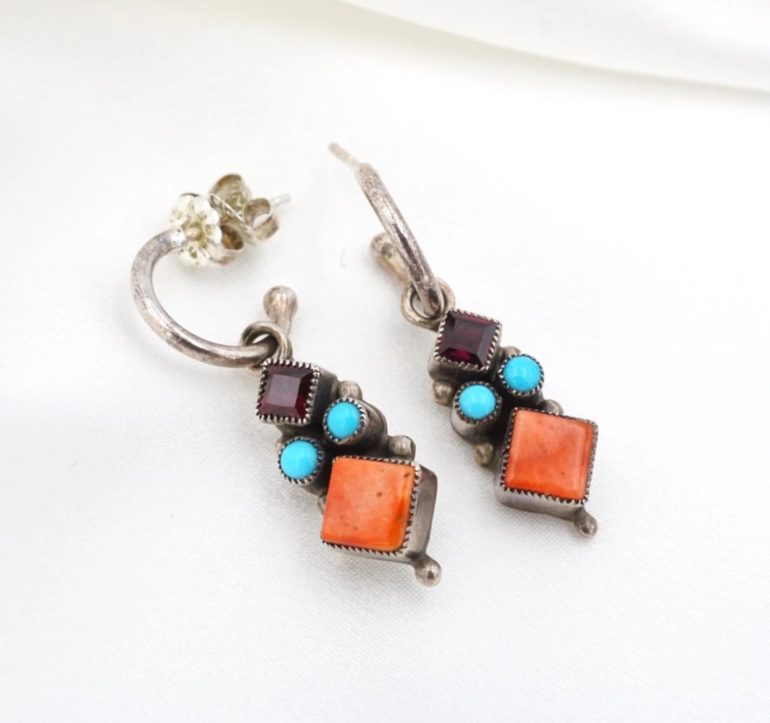 Navajo Turquoise Dangle Earrings Sterling Silver 1.3" Leo Feeney ES2894: These earrings from Navajo artisan Leo Feeney feature a princess-cut amethyst bezel-set atop an elongated sterling silver design embellished with natural turquoise and spiny oyster cabochons and chunk