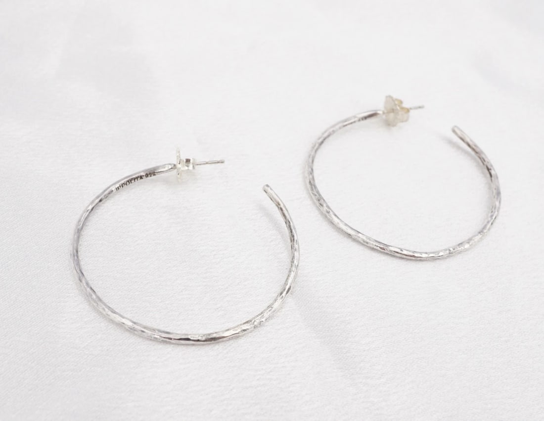 Ippolita Classico Hammered Hoop Earrings Sterling Silver 1.6" Large ES2792: These earrings from Ippolita feature a large, sterling silver hoop construction with an intricate hammered texture. The earrings fasten securely with sterling silver butterfly friction backs. Metal Ty
