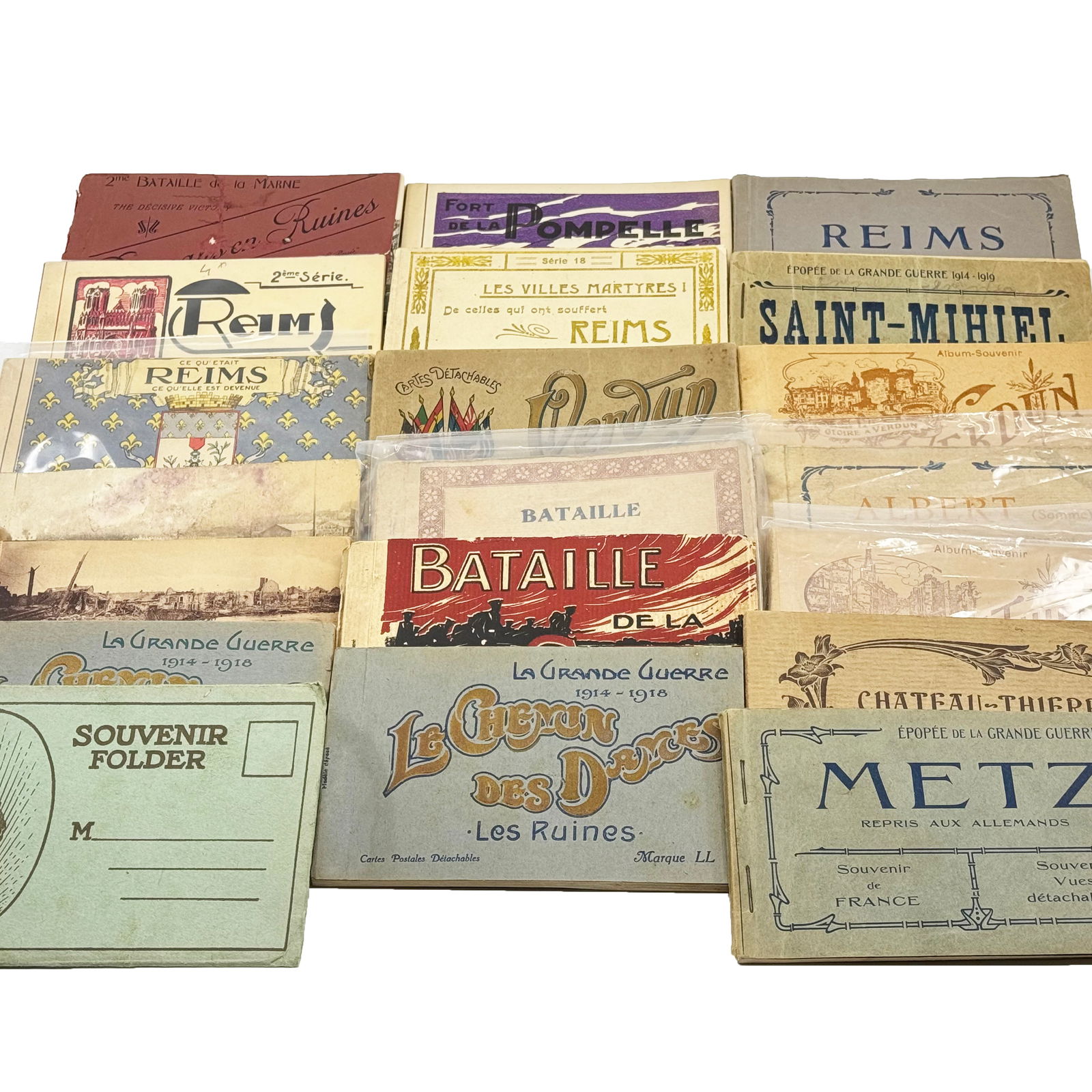 WWI Souvenir Postcard Books: Reims, Verdun, Somme & More: A collection of World War I-era souvenir postcard books featuring significant battle sites and cities affected by the war. Included are books on Reims, Verdun, Albert (Somme), La Pompelle, Metz, Chemi