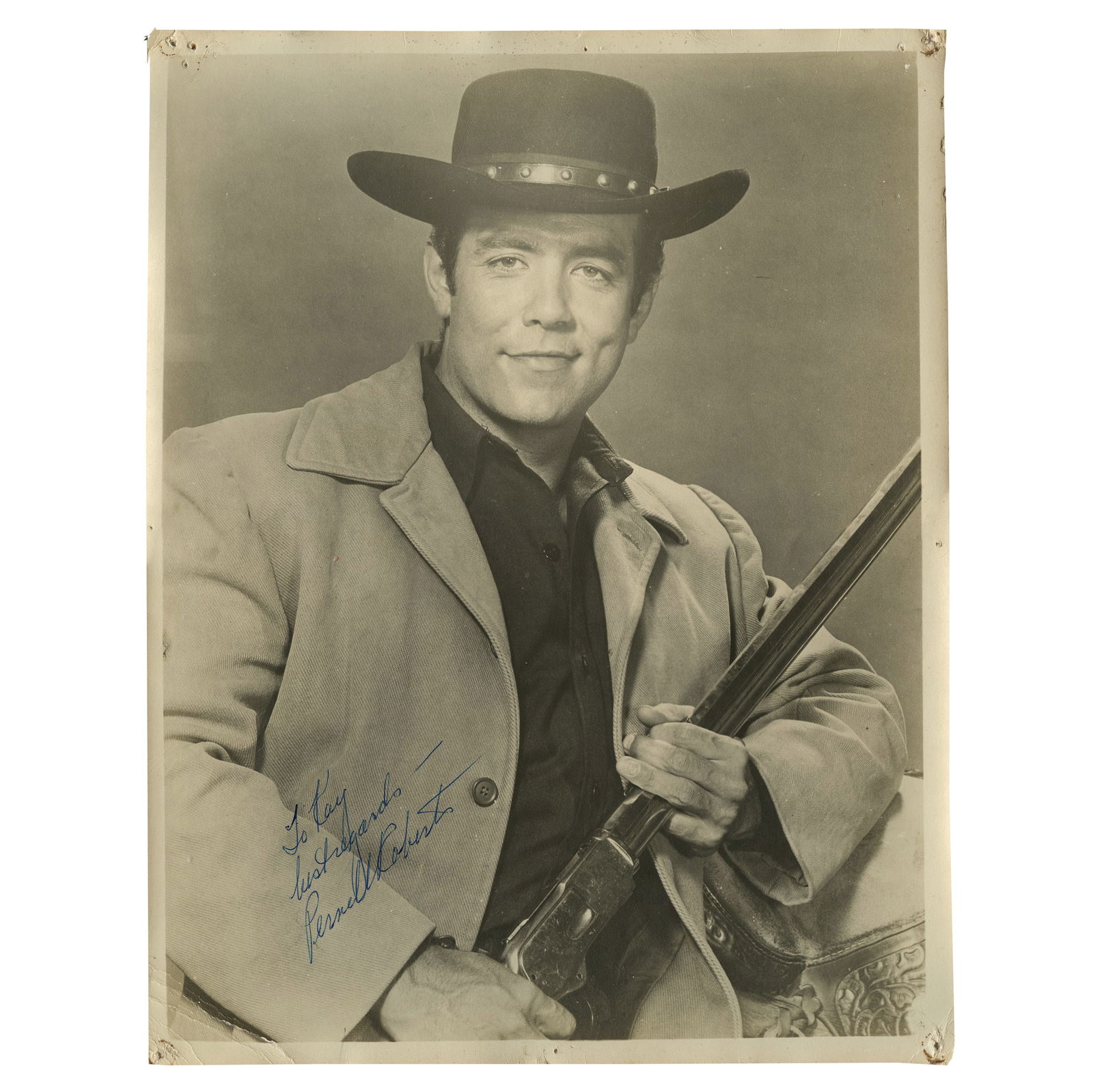 Pernell Roberts: Signed Oversize 11x14 Photo as Adam Cartwright, Bonanza (Early 1960s): Original 11"x14" oversized photo of Pernell Roberts in costume as Adam Cartwright from the television series Bonanza, holding a rifle. Circa early 1960s. Signed and inscribed in blue ink by Roberts. T