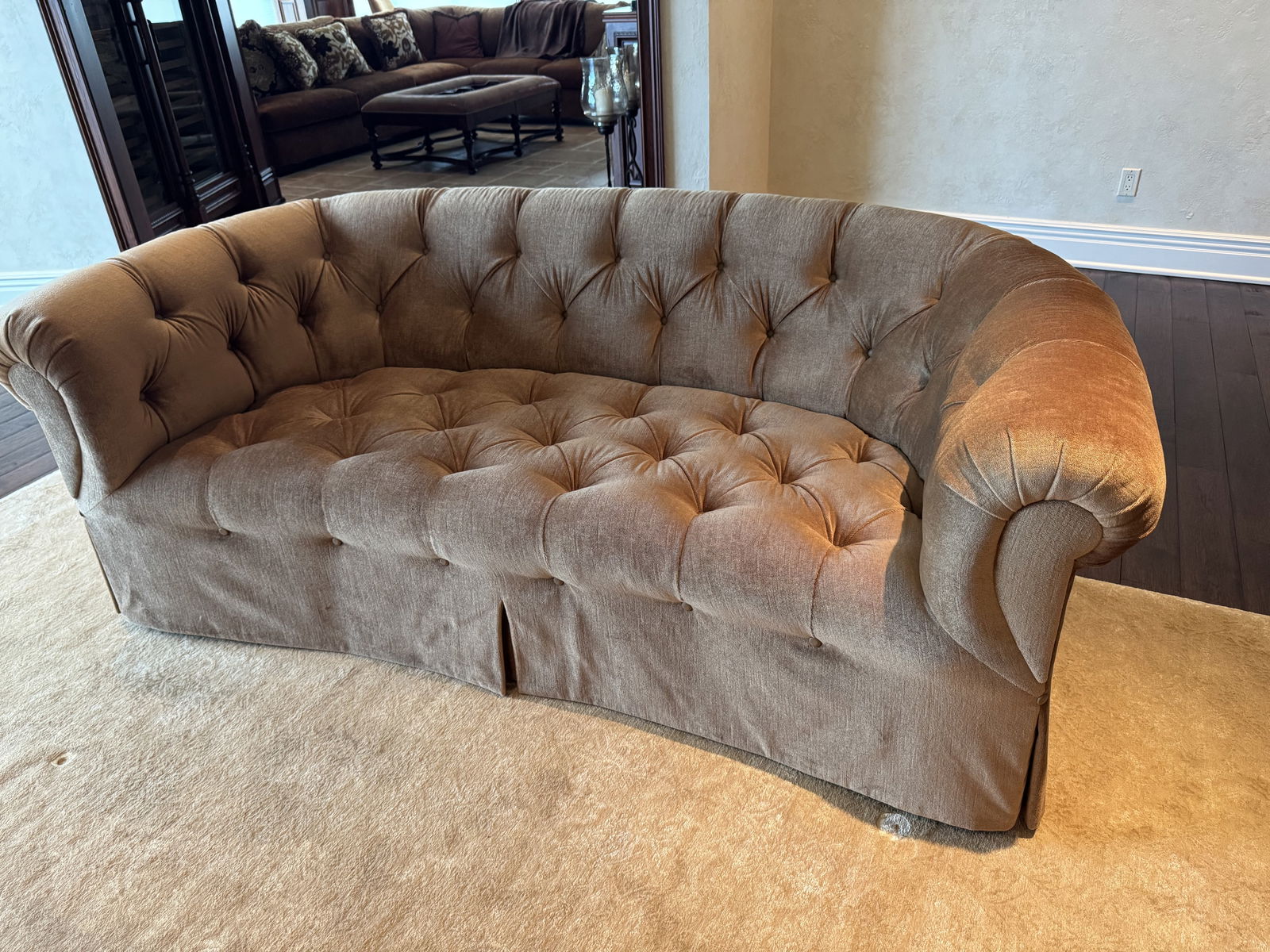 Michael Taylor Tufted Curved Sofa – Custom San Francisco Design: A fine upholstered tufted curved sofa by Michael Taylor Designs, San Francisco. Featuring classic rolled arms, deep tufted back, and a warm neutral upholstery, this elegant piece embodies Taylor’s t