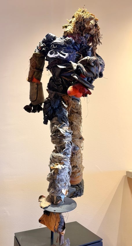 Diane Cooper Mixed Media Life-Size Sculpture Running Man Fabric & Metal Contemporary: Striking life-size mixed media sculpture by Diane Cooper, titled Running Man. This captivating contemporary artwork is crafted from layered fabric, metal, and found materials, creating a textured and