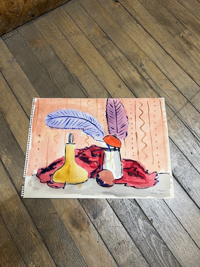 Charles Staples (1954) Still Life with Feathers & Vessel, Watercolor on Paper: A vibrant still life watercolor by Charles Staples, dated 1954. The composition features a yellow vessel, metallic cup, red drapery, and two large feathers in bold hues of purple and blue, set against