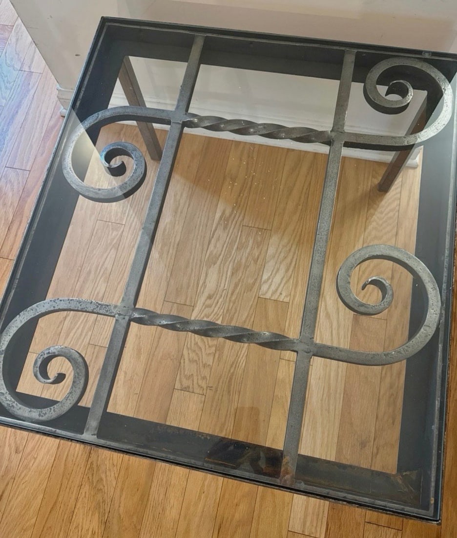 Hand-Forged Steel Scrollwork Coffee Table with Glass Top – Vintage Industrial Accent Table: Discover a beautifully crafted steel scrollwork coffee table featuring hand-forged details, elegant twisted iron bars, and a clear glass top that showcases the artistry beneath. This vintage industria