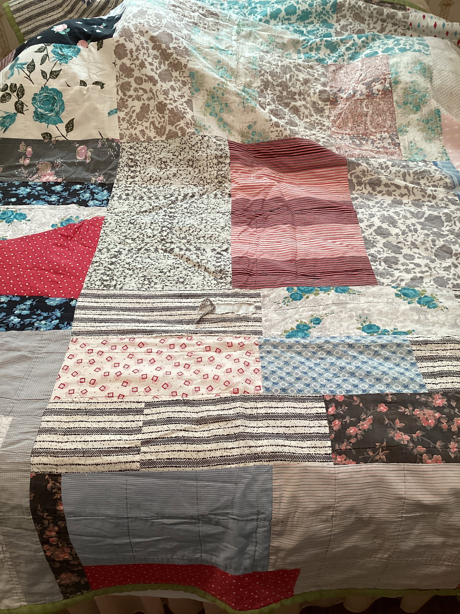 Hand Made Quilt: some small stains and one tear, approx. 58" x 85"